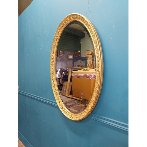 956 - 19th C. gilt oval wall mirror. {96 cm H x 68 cm W}.