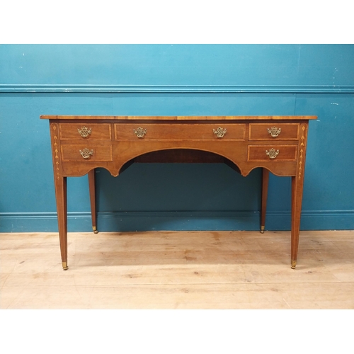 957 - Edwardian mahogany and satinwood desk raised on square tapered legs and brass castors {80 cm H x 129... 