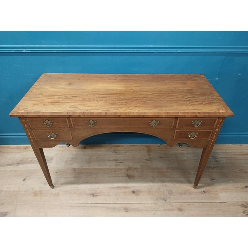 957 - Edwardian mahogany and satinwood desk raised on square tapered legs and brass castors {80 cm H x 129... 