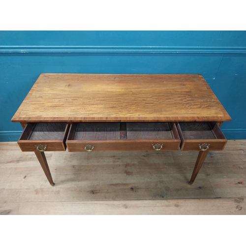 957 - Edwardian mahogany and satinwood desk raised on square tapered legs and brass castors {80 cm H x 129... 