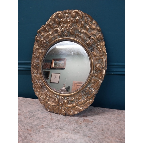 962 - Edwardian embossed brass wall mirror {43 cm H x 32 cm W}.