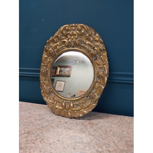 962 - Edwardian embossed brass wall mirror {43 cm H x 32 cm W}.