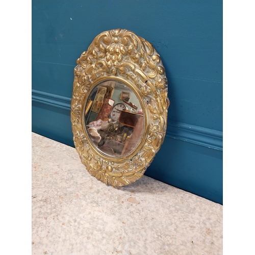 962 - Edwardian embossed brass wall mirror {43 cm H x 32 cm W}.