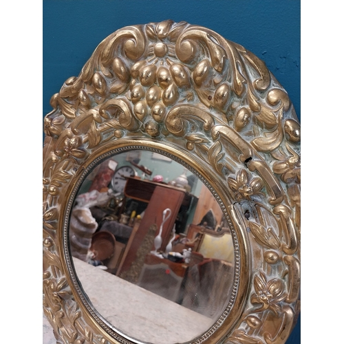 962 - Edwardian embossed brass wall mirror {43 cm H x 32 cm W}.