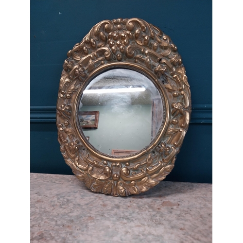 962 - Edwardian embossed brass wall mirror {43 cm H x 32 cm W}.