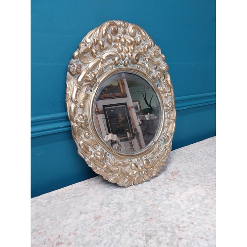 962 - Edwardian embossed brass wall mirror {43 cm H x 32 cm W}.