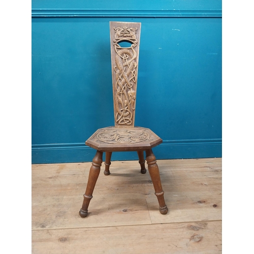 968 - Celtic carved oak spinning chair {90 cm H x 36 cm W x 40 cm D}.