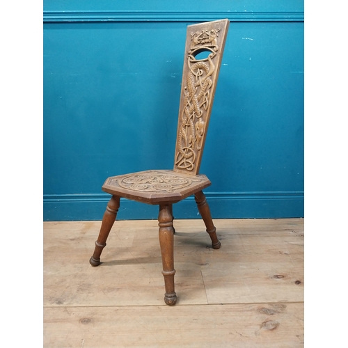 968 - Celtic carved oak spinning chair {90 cm H x 36 cm W x 40 cm D}.