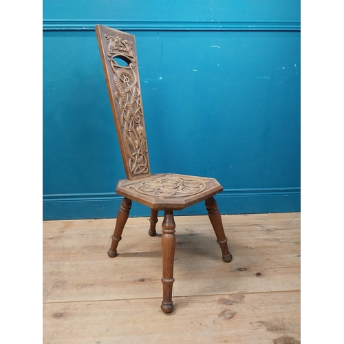 968 - Celtic carved oak spinning chair {90 cm H x 36 cm W x 40 cm D}.