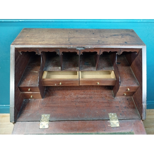 969 - Irish mahogany bureau with fitted interior and two drawers raised on square legs and castors {94 cm ... 