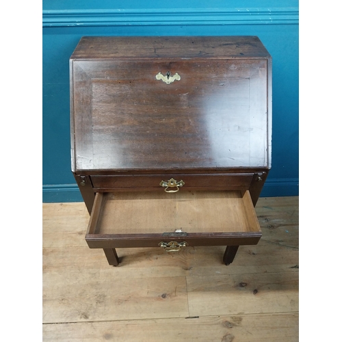 969 - Irish mahogany bureau with fitted interior and two drawers raised on square legs and castors {94 cm ... 