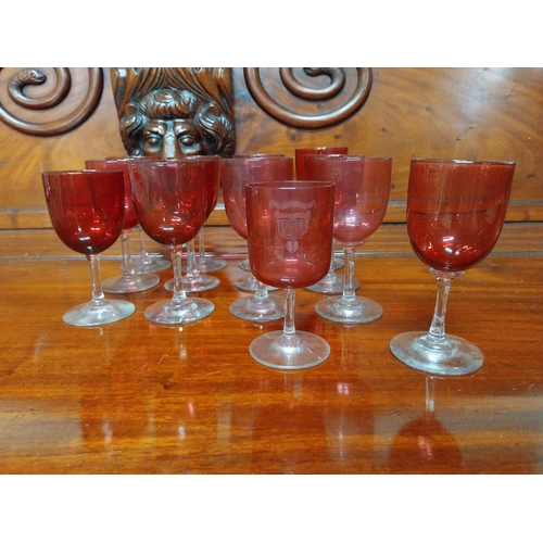 970 - Twelve 19th C. ruby glasses. {13 cm H x 6 cm Dia.}.