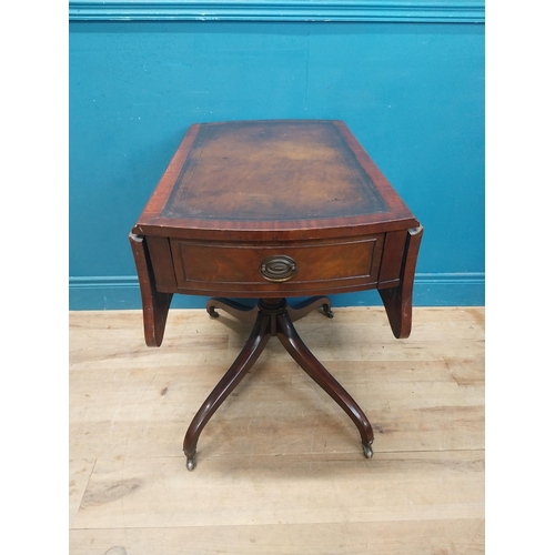 973 - Walnut drop leaf centre table with leather top raised on carved column, four outswept feet and casto... 