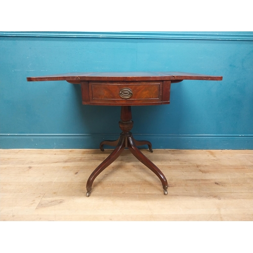 973 - Walnut drop leaf centre table with leather top raised on carved column, four outswept feet and casto... 