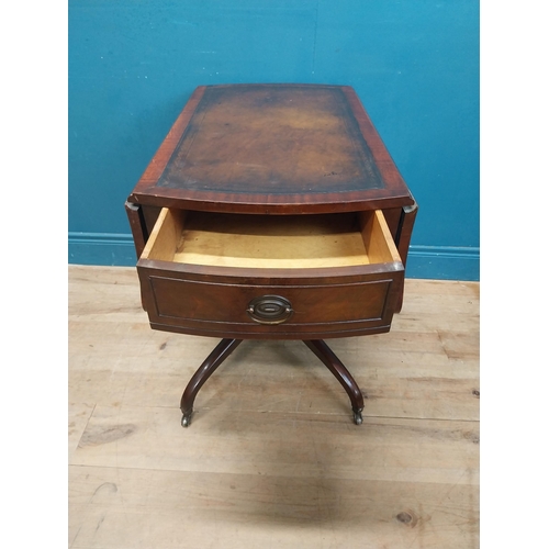 973 - Walnut drop leaf centre table with leather top raised on carved column, four outswept feet and casto... 