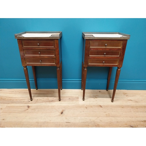 977 - Pair of 19th C. mahogany and brass bedside lockers with inset marble top and three drawers raised on... 