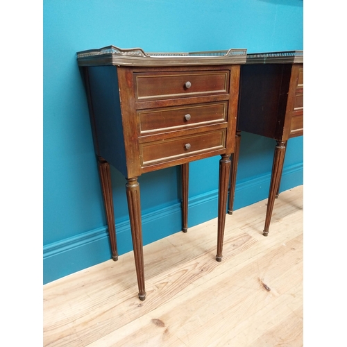 977 - Pair of 19th C. mahogany and brass bedside lockers with inset marble top and three drawers raised on... 