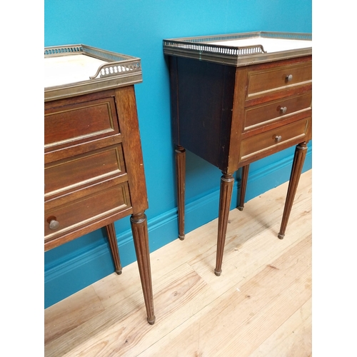 977 - Pair of 19th C. mahogany and brass bedside lockers with inset marble top and three drawers raised on... 