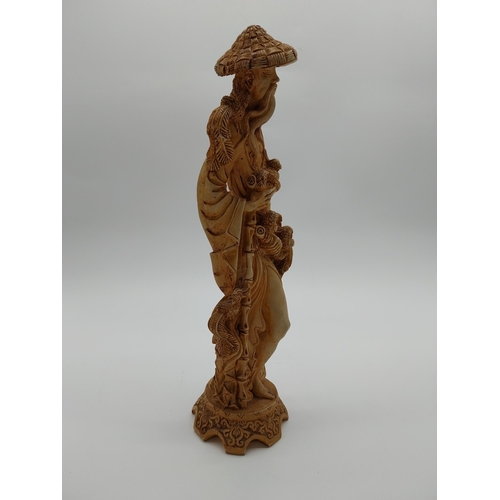 981 - Resin oriental figure of a Man. {37 cm H x 12 cm W x 11 cm D}.