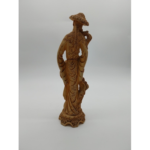 981 - Resin oriental figure of a Man. {37 cm H x 12 cm W x 11 cm D}.