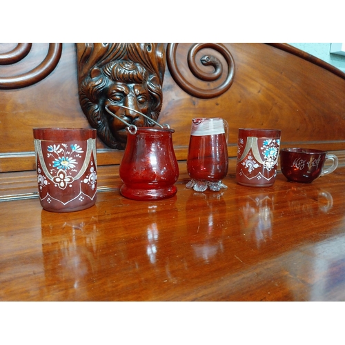 990 - Five pieces of 19th C. ruby glass jugs and vases.