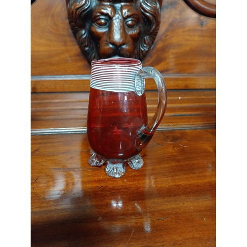 990 - Five pieces of 19th C. ruby glass jugs and vases.