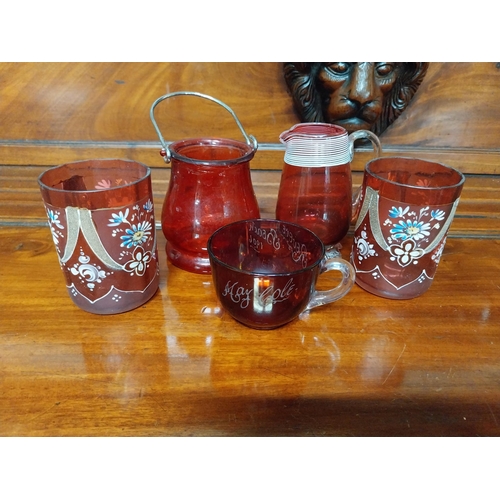 990 - Five pieces of 19th C. ruby glass jugs and vases.