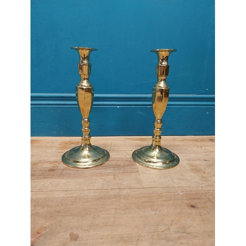 991 - Pair of brass candle sticks {27 cm H x 13 cm Dia.}.