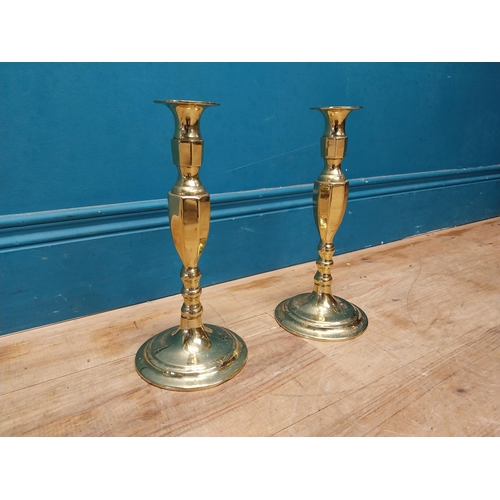 991 - Pair of brass candle sticks {27 cm H x 13 cm Dia.}.