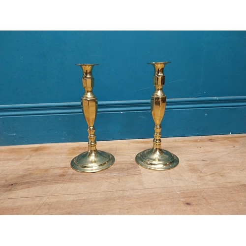 991 - Pair of brass candle sticks {27 cm H x 13 cm Dia.}.