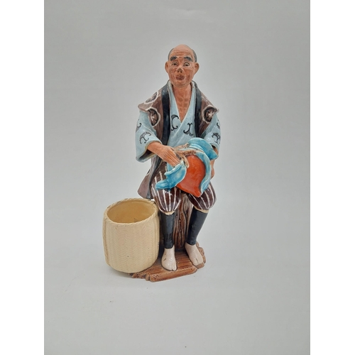 998 - Glazed stoneware Oriental figure of a Fruit Picker. {23 cm H x 14 cm D x 9 cm D}.