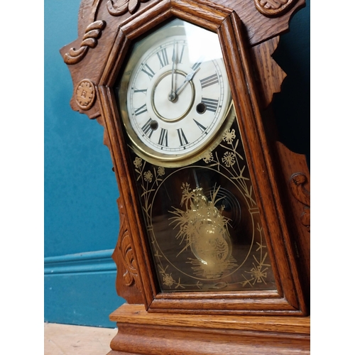 999 - Early 20th C. oak gingerbread clock. {60 cm H x 37 cm W x 14 cm D}.