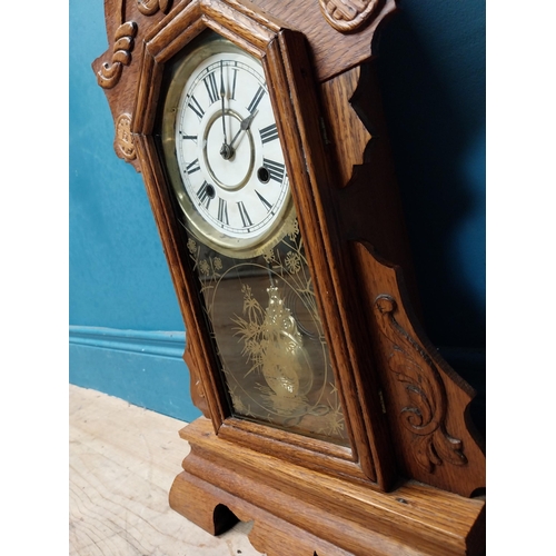 999 - Early 20th C. oak gingerbread clock. {60 cm H x 37 cm W x 14 cm D}.