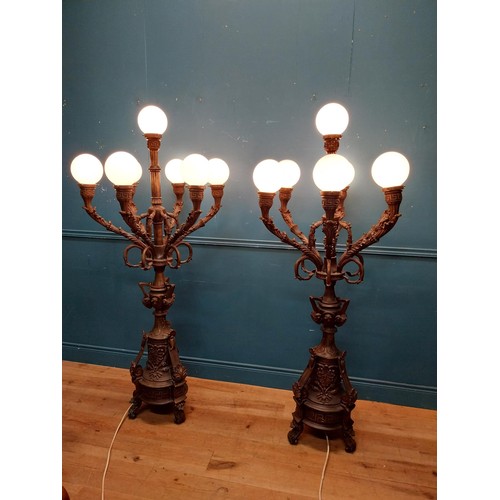 1002 - Pair of decorative bronze floor candelabras with opaline glass shades {174 cm H x 75 cm Dia.}.