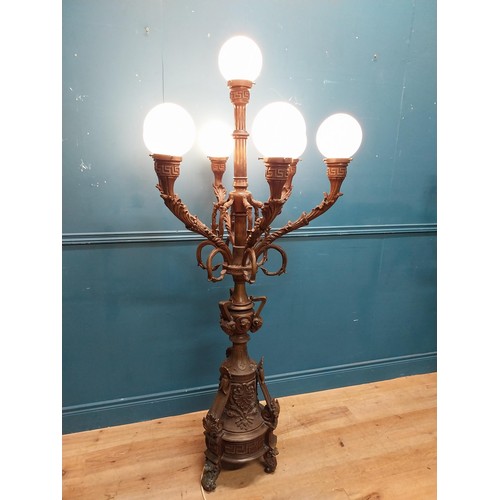 1002 - Pair of decorative bronze floor candelabras with opaline glass shades {174 cm H x 75 cm Dia.}.