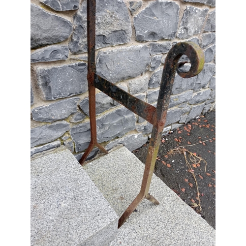 1000A - Wrought iron foot scraper {H 168cm x W 20cm x D 37cm }.