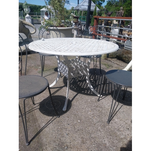 1018 - Cast iron aluminium garden table and four wrought iron garden chairs {Tbl. 73 cm H x 106 cm Dia. and... 