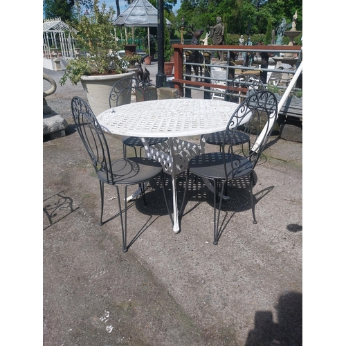 1018 - Cast iron aluminium garden table and four wrought iron garden chairs {Tbl. 73 cm H x 106 cm Dia. and... 