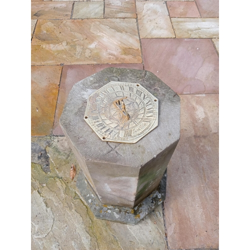 1020 - Sandstone and brass hexagon top sundial {H 75cm x D 30cm}.