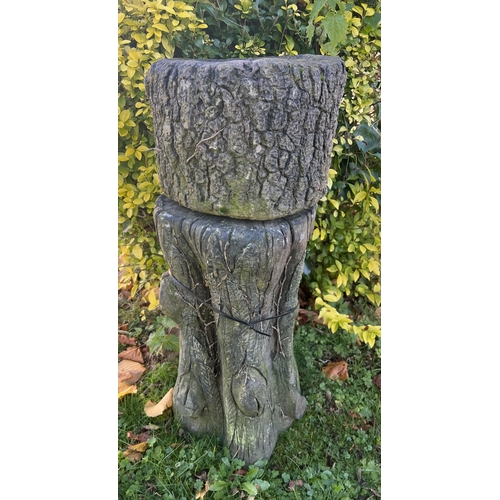 1027 - Reconstituted stone faux bois plater raised on plinth {H 76cm x Dia 32cm }.