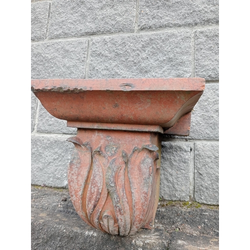 1030 - Pair of terracotta pillar caps {H 365cm x W 32cm x D 46cm }.