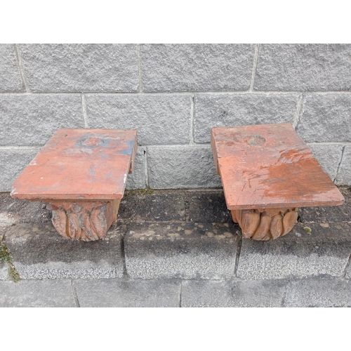 1030 - Pair of terracotta pillar caps {H 365cm x W 32cm x D 46cm }.