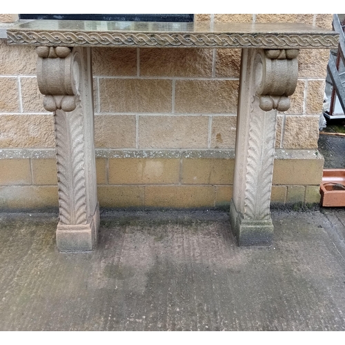 115 - Sandstone chimney piece with scroll and corbel design{H 120cm x W 140cm x D 45cm }.