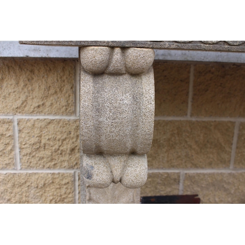 115 - Sandstone chimney piece with scroll and corbel design{H 120cm x W 140cm x D 45cm }.