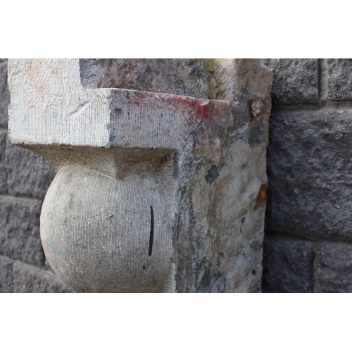 119 - Pair of 19th C. blue stone balcony corbels decorated with a ball {H 79cm x W 36cm x D 25cm }.