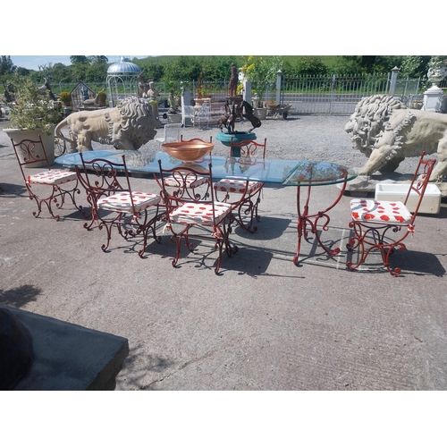 128 - Good quality wrought iron garden table with glass top and detachable d-ends and six matching chairs ... 