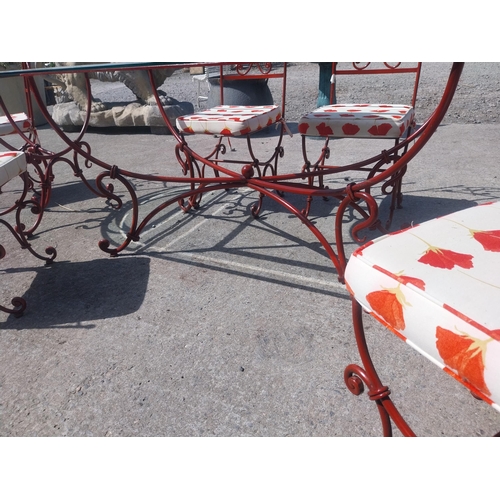 128 - Good quality wrought iron garden table with glass top and detachable d-ends and six matching chairs ... 