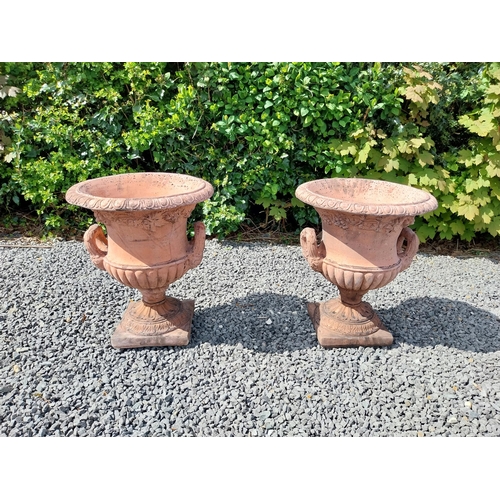 13 - Pair of moulded terracotta lattice urns ivy leaf decoration {56 cm H x 46 cm Dia.}.