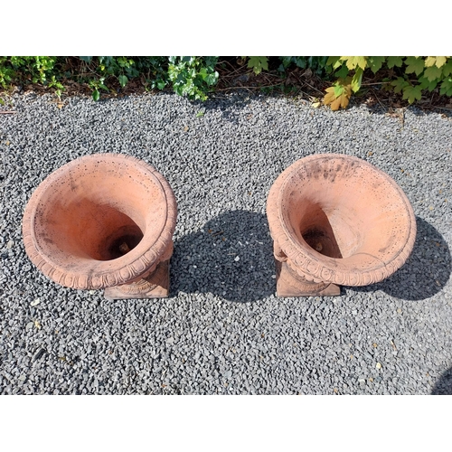 13 - Pair of moulded terracotta lattice urns ivy leaf decoration {56 cm H x 46 cm Dia.}.