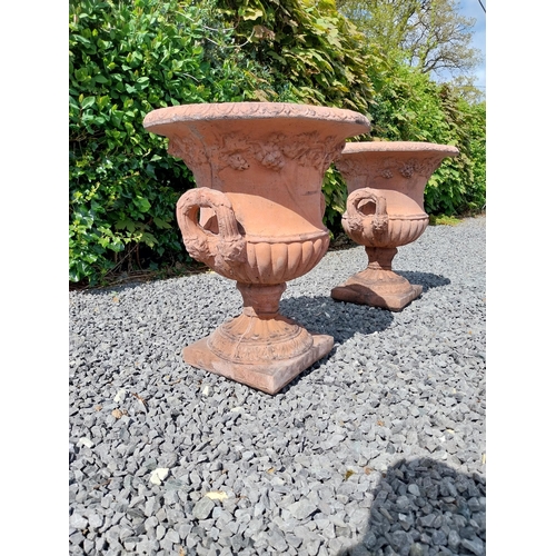 13 - Pair of moulded terracotta lattice urns ivy leaf decoration {56 cm H x 46 cm Dia.}.